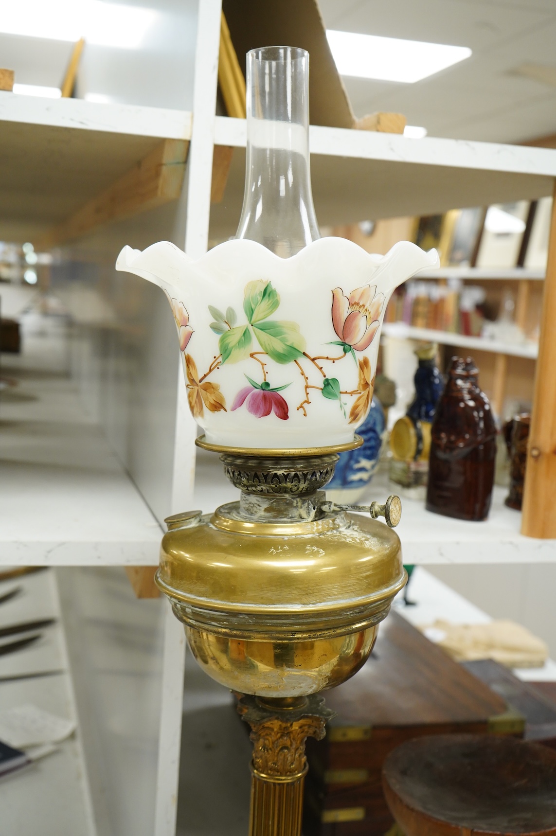 An Edwardian Corinthian column oil lamp, 72 high not including chimney
